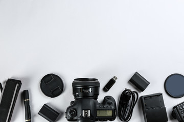 Flat lay composition with equipment for professional photographer on white background. Space for...