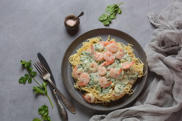 Italian Spaghetti or Pasta with shrimps, garlic and herbs in a creamy Alfredo sauce. Keto diet food concept