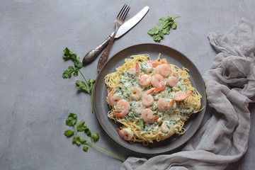 Italian Spaghetti or Pasta with shrimps, garlic and herbs in a creamy Alfredo sauce. Keto diet food concept