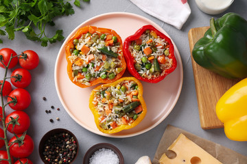 Flat lay composition with tasty stuffed bell peppers on grey table