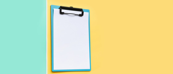 close up of empty paper on yellow and green background