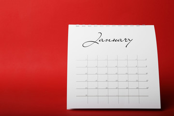 Paper calendar on red background. Planning concept