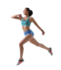 Athletic young woman running on white background, side view