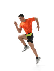 Fototapeta na wymiar Athletic young man running on white background, side view