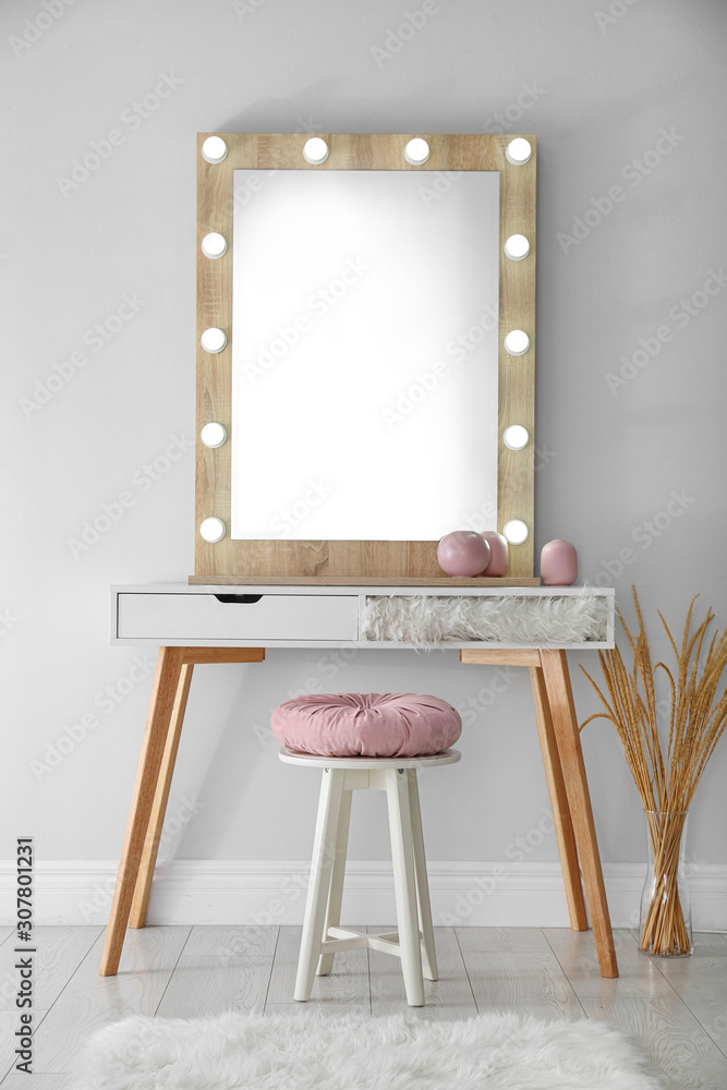 Poster Stylish mirror with lamps near light wall in room