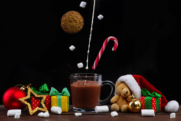 Christmas drink. Sweets fly in hot chocolate with marshmallows