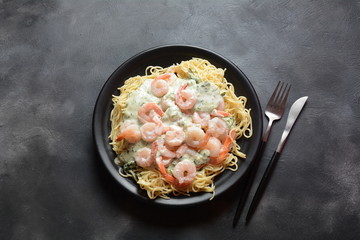Italian Spaghetti or Pasta with shrimps, garlic and herbs in a creamy Alfredo sauce. Keto diet food concept