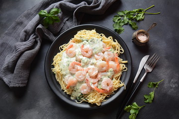 Italian Spaghetti or Pasta with shrimps, garlic and herbs in a creamy Alfredo sauce. Keto diet food concept