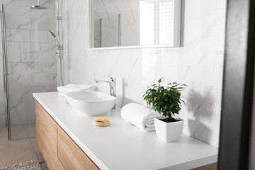 Naklejka na ściany i meble Modern mirror and vessel sink in stylish bathroom