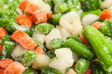 Different frozen vegetables as background, closeup view