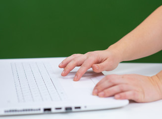 hand on blackboard background I type on the laptop