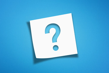 Note paper with question mark on blue background