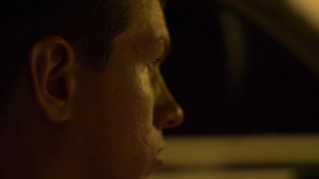 Tired young man driving his car