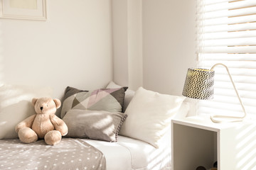 Modern child room interior with comfortable bed