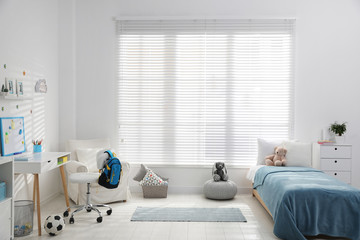 Modern child room interior with comfortable bed