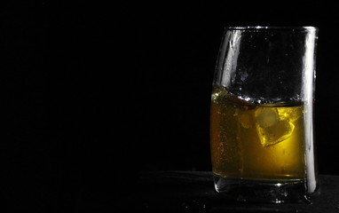 glass of whiskey with ice