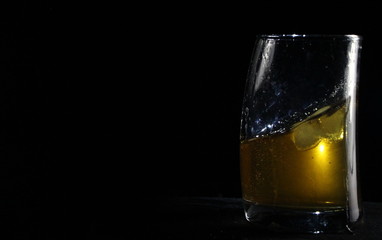 glass of whiskey with ice