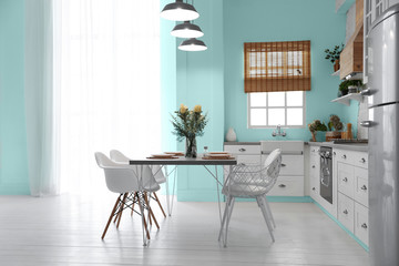 Stylish kitchen interior design inspired by color of the year 2020 (bleached coral)