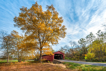 Rustic old covered bridge in the bucolic setting of the Maryland countryside during Autumn