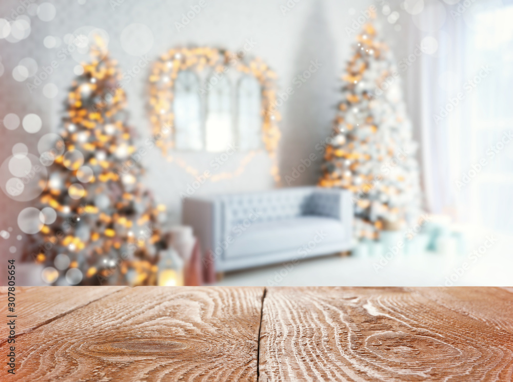 Poster Empty wooden surface and blurred view of room decorated for Christmas