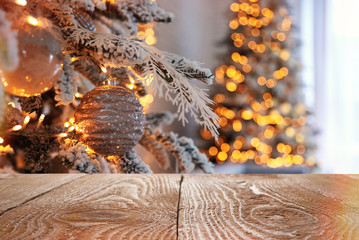 Beautiful Christmas tree and wooden surface against blurred background