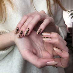French manicure on women's thick handles with leopard design.