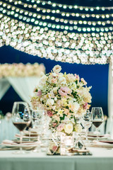 Table setting at a luxury wedding and Beautiful flowers on the table.