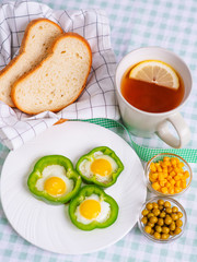eggs served in bell peppers for Breakfast, with tea with lemon