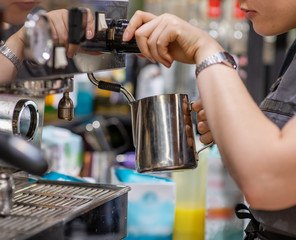 Fototapeta na wymiar Professional coffee machine making espresso in a cafe
