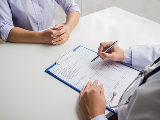 The doctor explained the health examination results to the patient, medical checkup concept