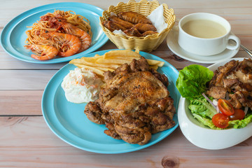 Assorted western food main course on table, flat lay top down view.