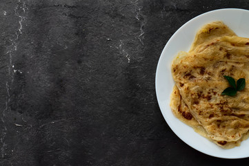 Top view of roti canai with space for text