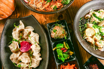 A buffet of Asian speicialties like Wonton Soup, dumplings, Poke Bowl and Asian salad.