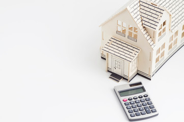 Real Estate Concept: House and calculator