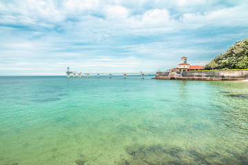 Obraz premium Busena-marinepark, Okinawa, Japan. Lighthouse by the sea