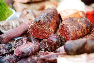 Selection of assorted home made meats, jerky and sausages on a farmer's market in Vilnius, Lithuania.