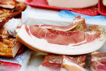 Selection of assorted home made meats, jerky and sausages on a farmer's market in Vilnius,...