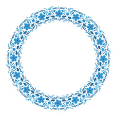 Circular floral ornament in blue and light blue tones on a white background