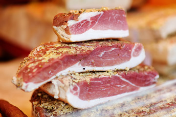 Selection of assorted home made meats, jerky and sausages on a farmer's market in Vilnius, Lithuania.