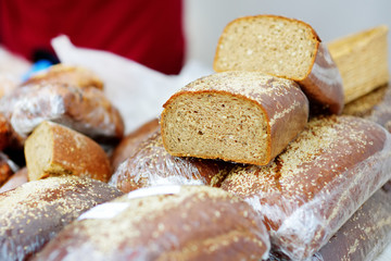 Loaves of organic bread for sale at outdoor farmers market in Vilnius, Lithuania.