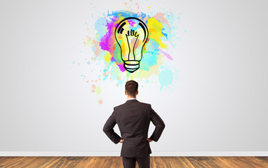 Businessman looking to a wall with new idea concept
