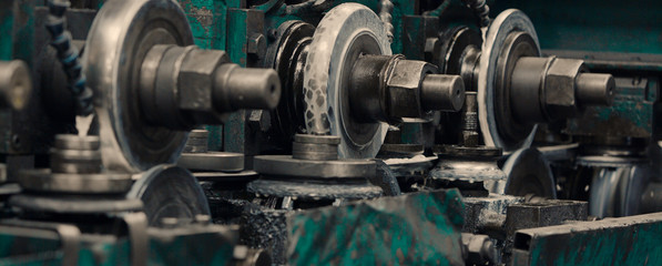 Obraz premium Industrial metal sheet coils connected with metal sheet profile forming machine