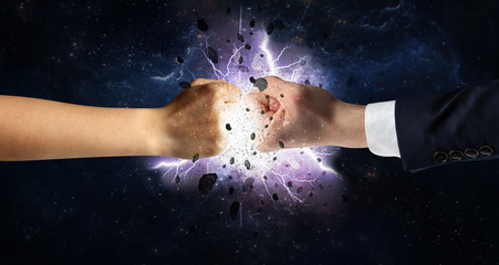 Fototapeta na wymiar Two hands fighting with storm explosion concept