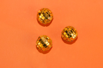 Christmas background, texture. Disco balls on an orange background. Glitter. Place for text. Christmas concept. Holiday card