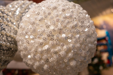 New Year and Christmas still life.White balls for the Christmas tree. Selective focus.