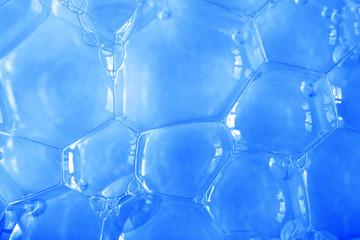 Close-up blue soap bubbles, abstract background. Color of the year 2020