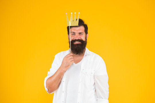 how do i look now. king of party. royal style. brutal bearded man king. Costume party. happy birthday. hipster booth props yellow background. ready for fun. bearded man party crown