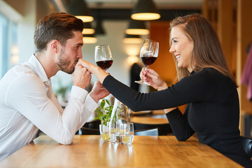 Amorous man gives his girlfriend a kiss