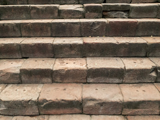 Old damaged stone staircase background.