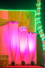 indian wedding ceremony :stage decoration with lighting and flower 